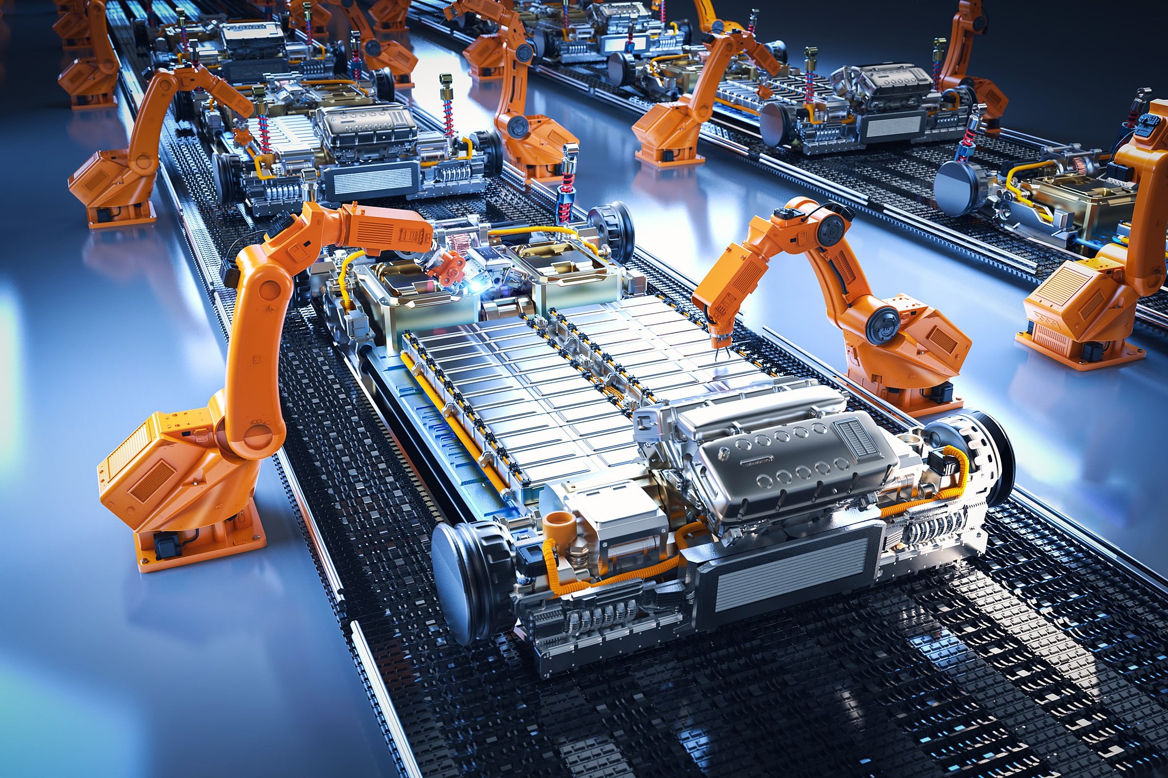 Robotic arms assembling battery packs on an automated production line